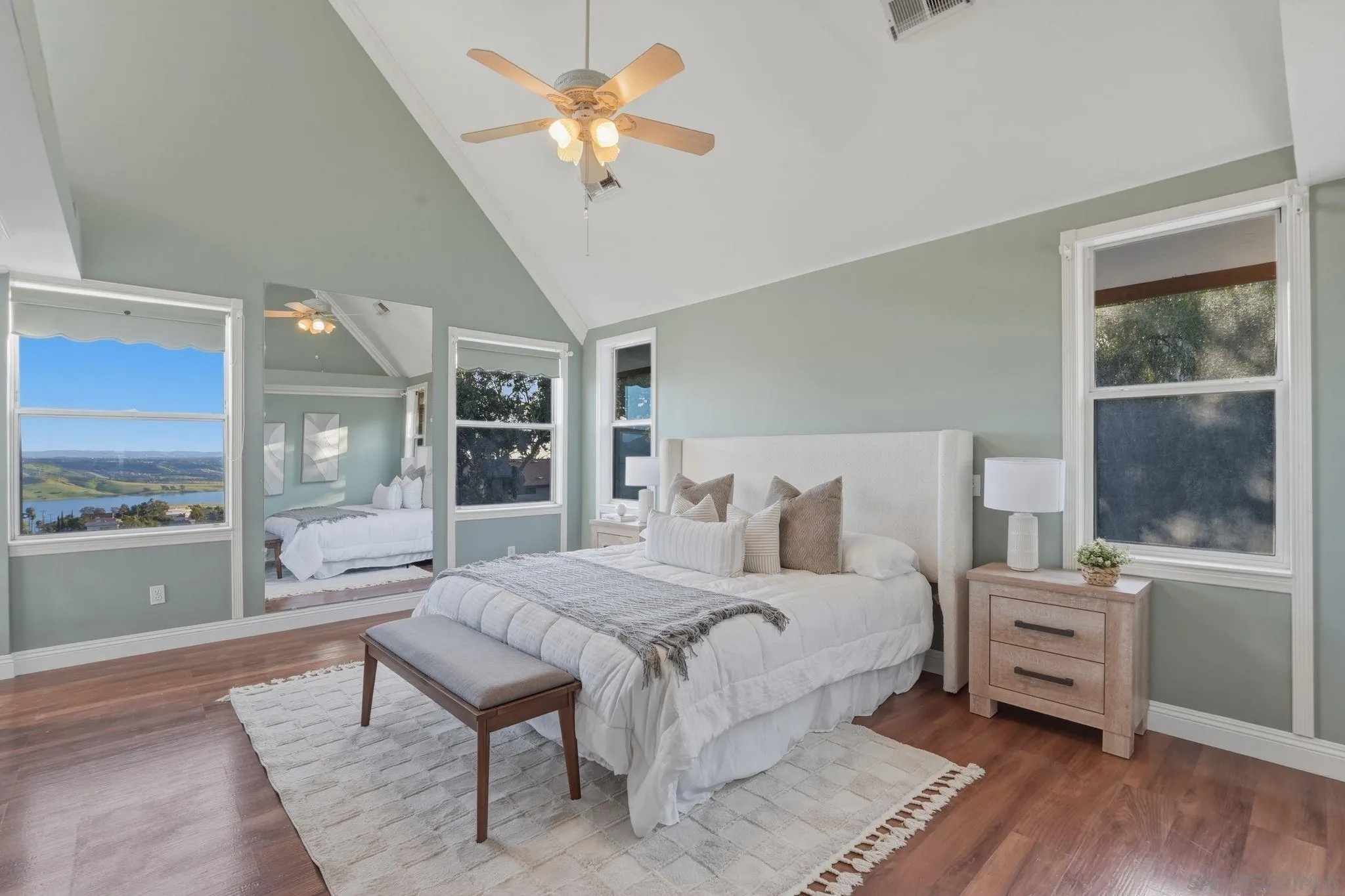 1650 Cuyamaca Avenue Spring Valley, CA 91977 - Photo 4 of 35 a bedroom with a large bed and a chandelier