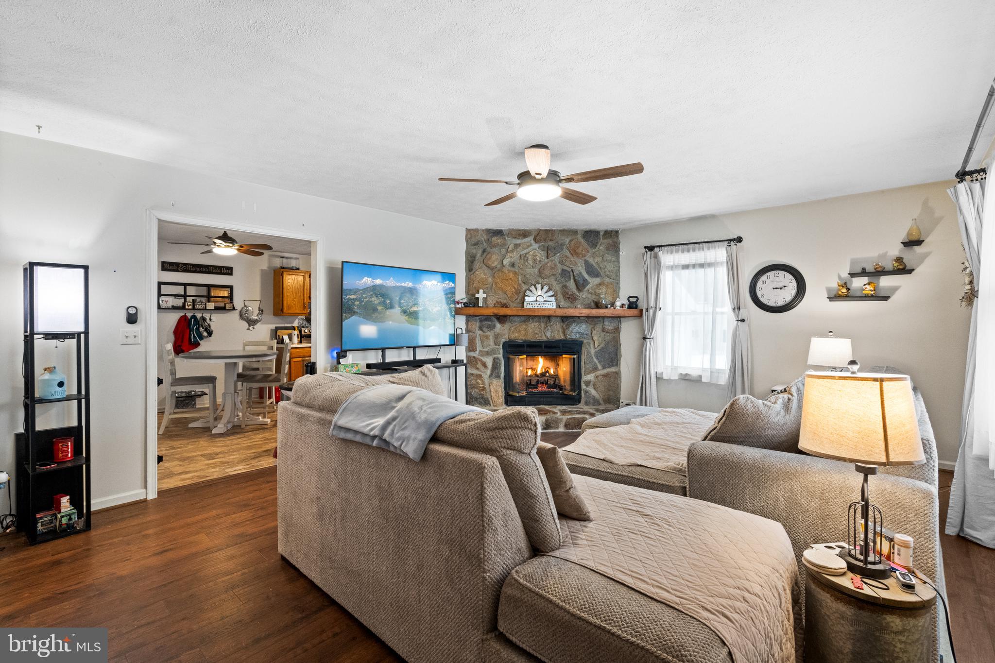 25282 Independence Road Unionville, VA 22567 - Photo 7 of 33 Living Room with ceiling fan and gas fireplace