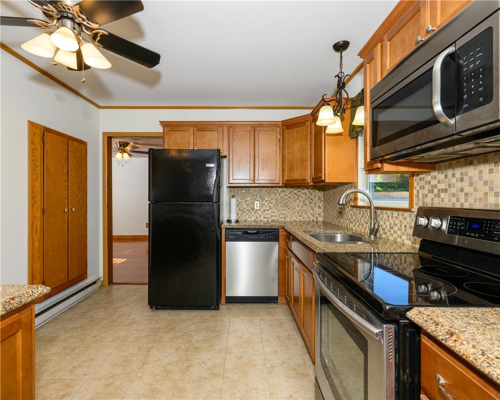 1644 9th Street Bethlehem, PA 18020 - Photo 7 of 27 A well-equipped kitchen showcasing a full range of modern appliances and elegant granite countertops.