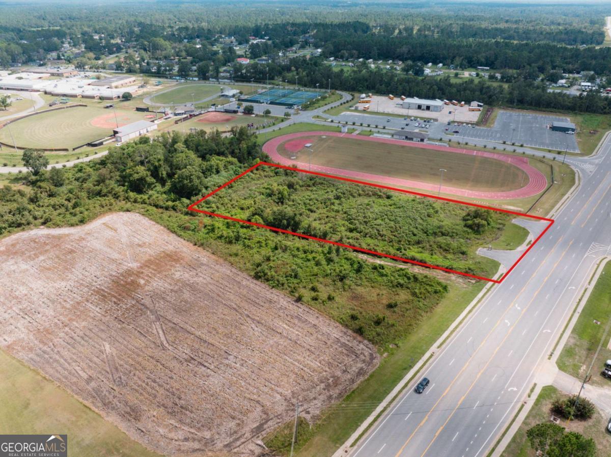 1657 Hatch Parkway South Baxley, GA 31513 - Photo 6 of 6 a view of a swimming pool with a yard