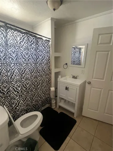 a bathroom with a toilet and a sink