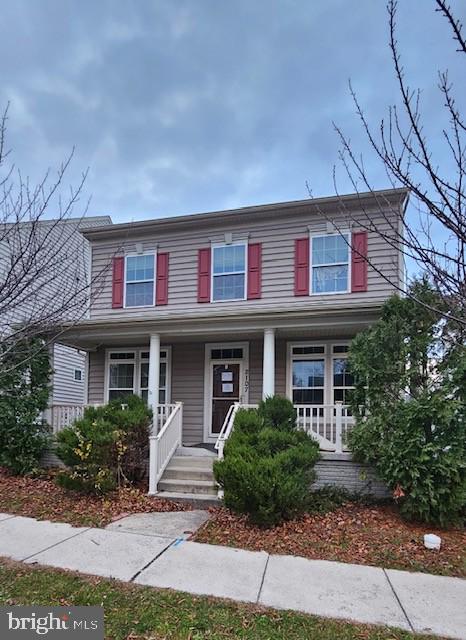 2107 Battery Lane Frederick, MD 21702 - Photo 1 of 16 a front view of a house with garden