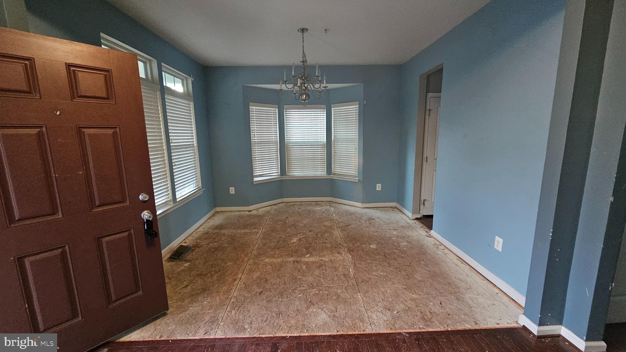 2107 Battery Lane Frederick, MD 21702 - Photo 6 of 16 an empty room with windows and cabinet