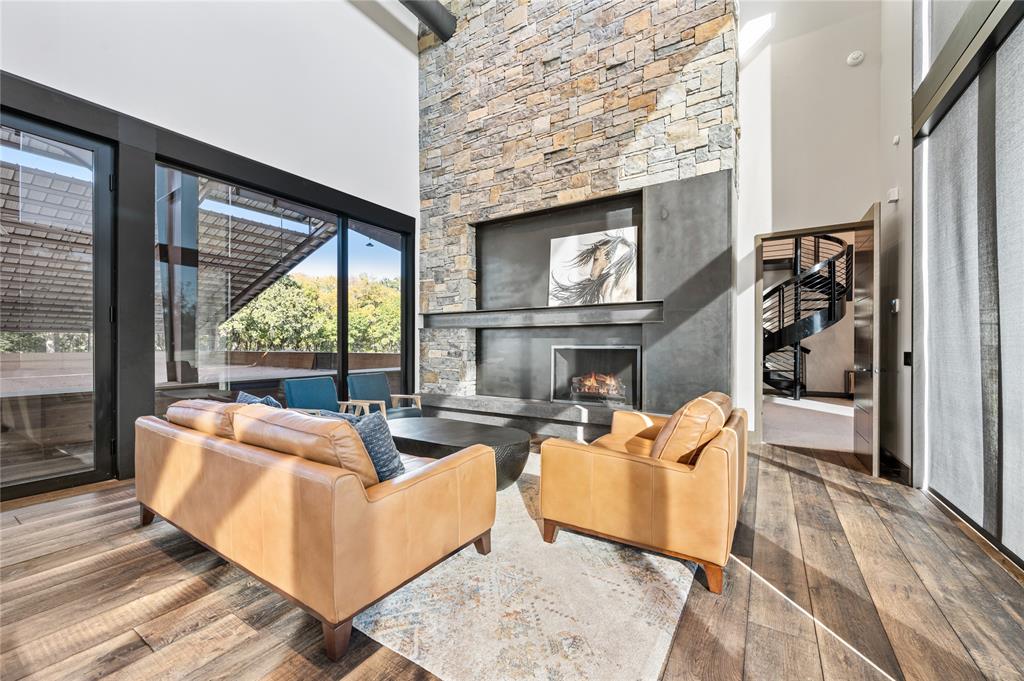 520 High Rdg Drive McKinney, TX 75071 - Photo 26 of 39 a living room with fireplace furniture and a floor to ceiling window