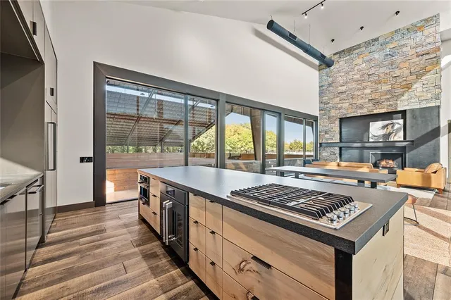 a view of a hallway with wooden floor and front door