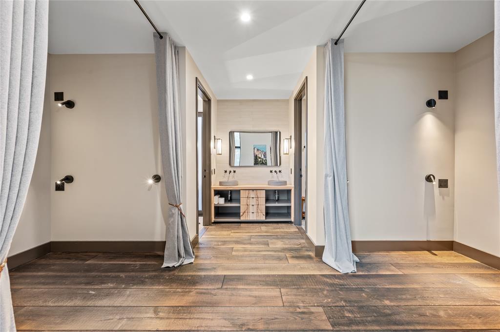 520 High Rdg Drive McKinney, TX 75071 - Photo 32 of 39 a view of a hallway with wooden floor and front door