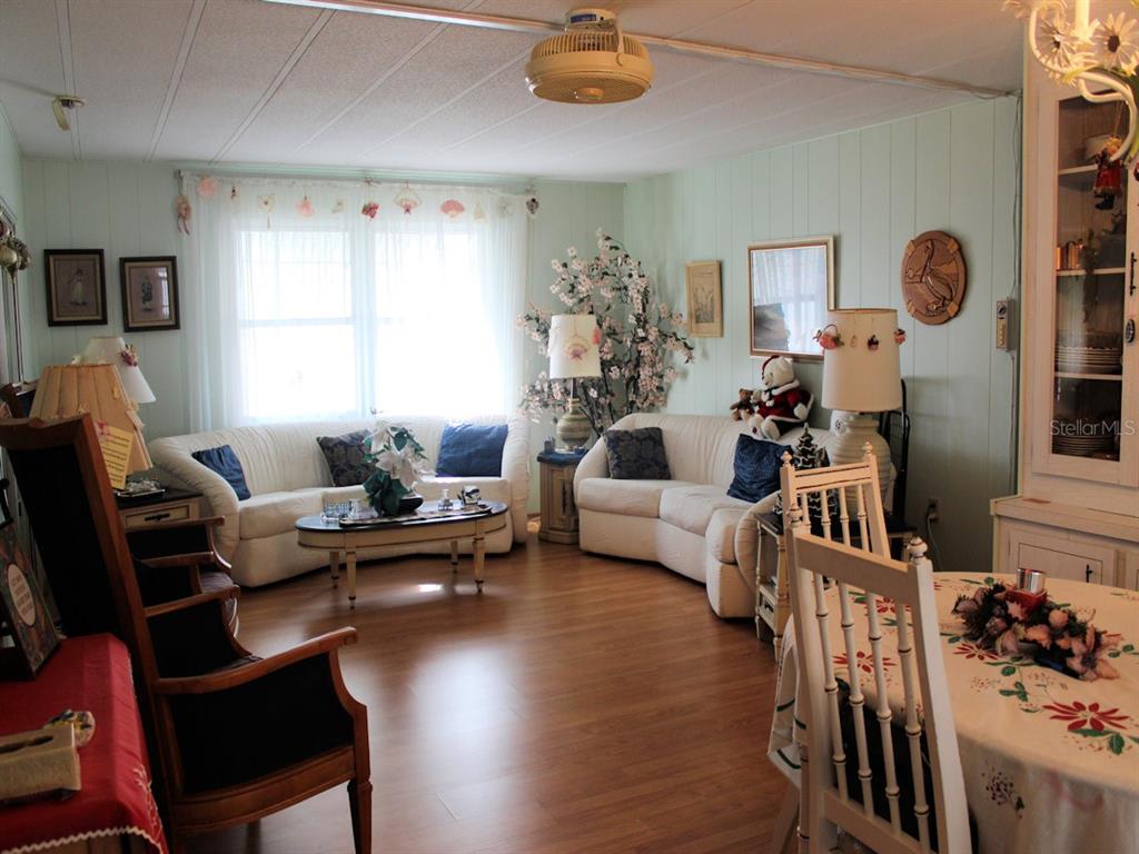 55 Thatch Palm Street West Largo, FL 33770 - Photo 7 of 14 a living room with furniture and wooden floor