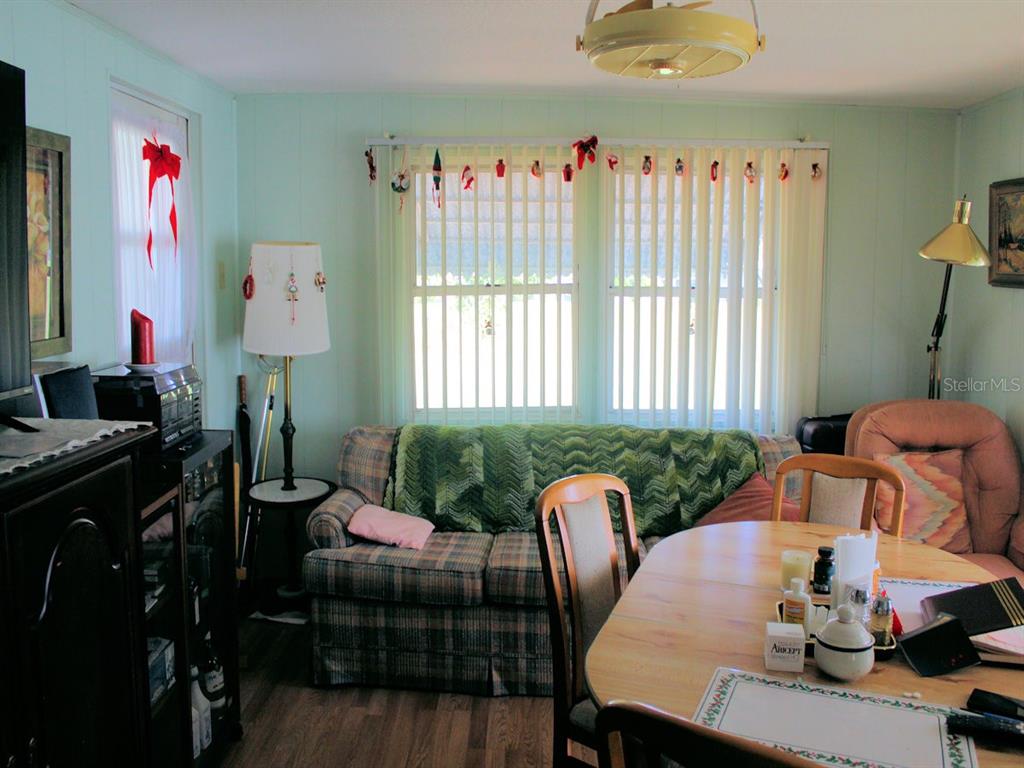 55 Thatch Palm Street West Largo, FL 33770 - Photo 8 of 14 a living room with furniture and a window
