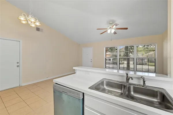 a view with a sink and chandelier
