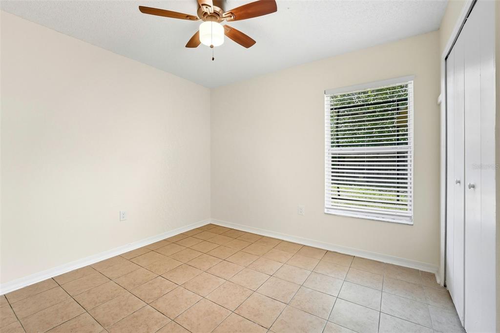 1148 Golden Gate Avenue Orlando, FL 32808 - Photo 19 of 26 an empty room with windows