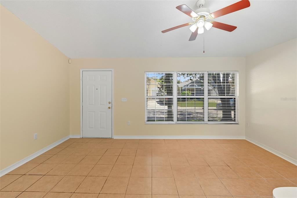 1148 Golden Gate Avenue Orlando, FL 32808 - Photo 7 of 26 a view of an empty room with a window