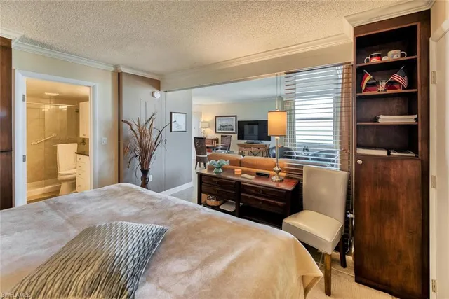 a bedroom with a bed and furniture