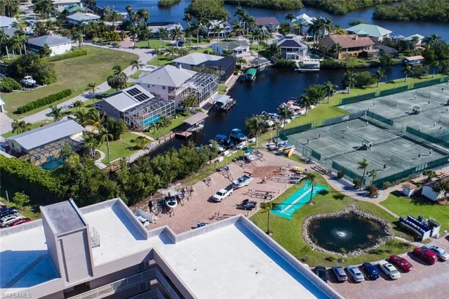 an aerial view of a house with yard swimming pool and outdoor seating