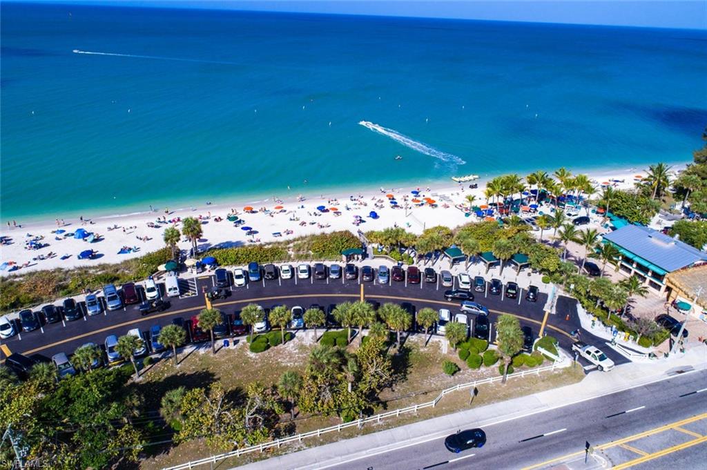 5900 Bonita Beach Road Southwest, Unit 1004 Bonita Springs, FL 34134 - Photo 26 of 27 a view of a bench in a lot of flowers