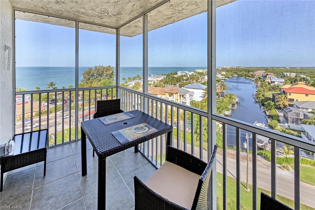 5900 Bonita Beach Road Southwest, Unit 1004 Bonita Springs, FL 34134 - Photo 3 of 27 a view of a balcony with chairs