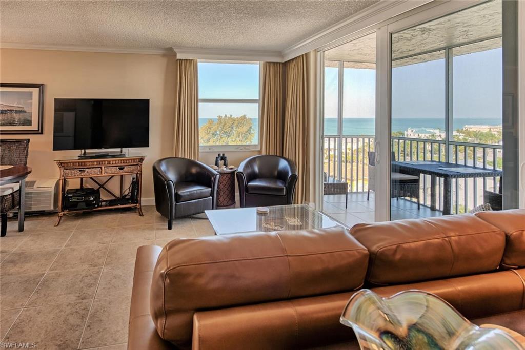 5900 Bonita Beach Road Southwest, Unit 1004 Bonita Springs, FL 34134 - Photo 7 of 27 a bedroom with two beds and a large window