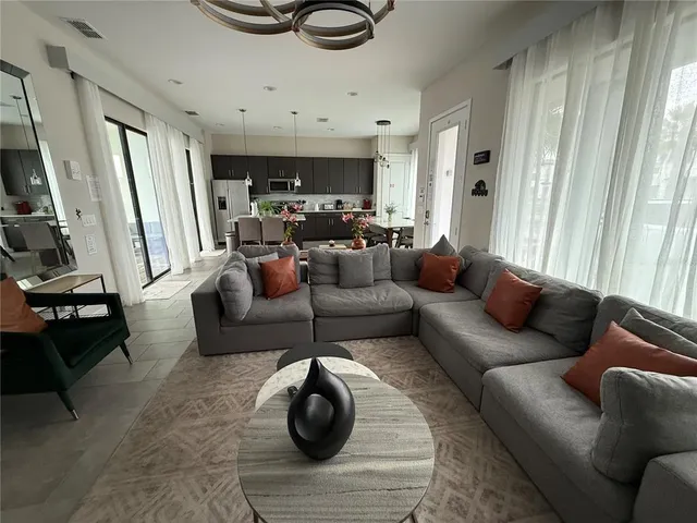 a living room with furniture and a rug