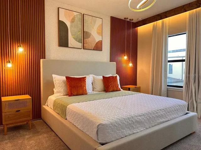 a bedroom with a bed and window