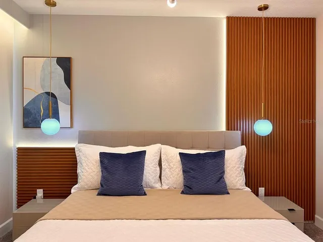 a living room with a bed and furniture