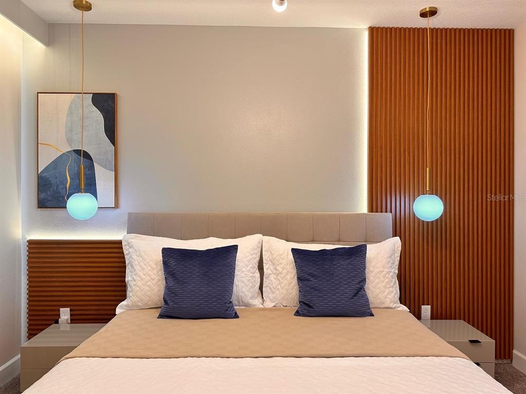 304 Villa Domani Court Davenport, FL 33896 - Photo 18 of 37 a living room with a bed and furniture