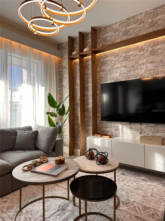 304 Villa Domani Court Davenport, FL 33896 - Photo 9 of 37 a living room with furniture and a flat screen tv