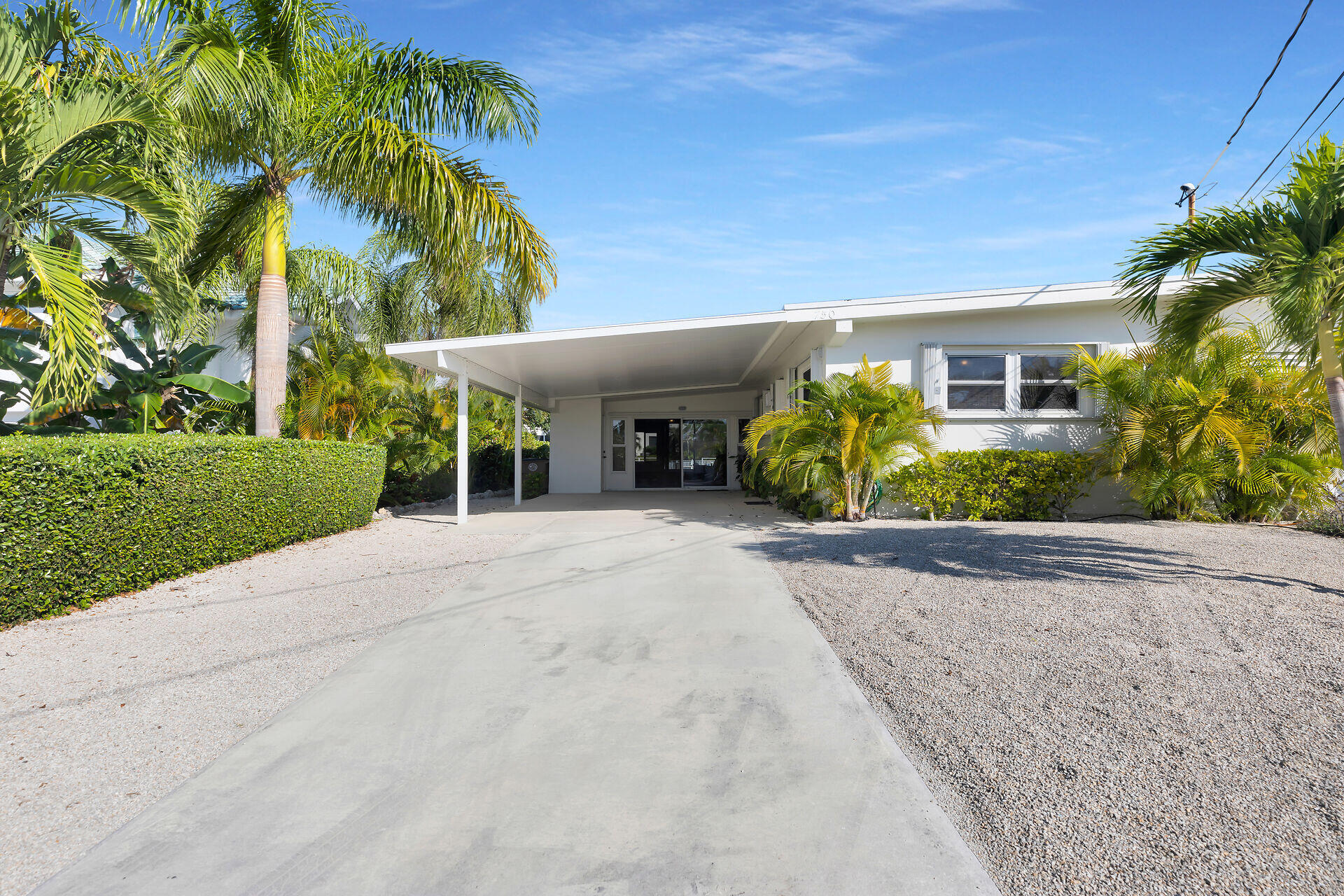 750 9th Street Key Colony Beach, FL 33051 - Photo 1 of 30 a view of a house with a yard and plant