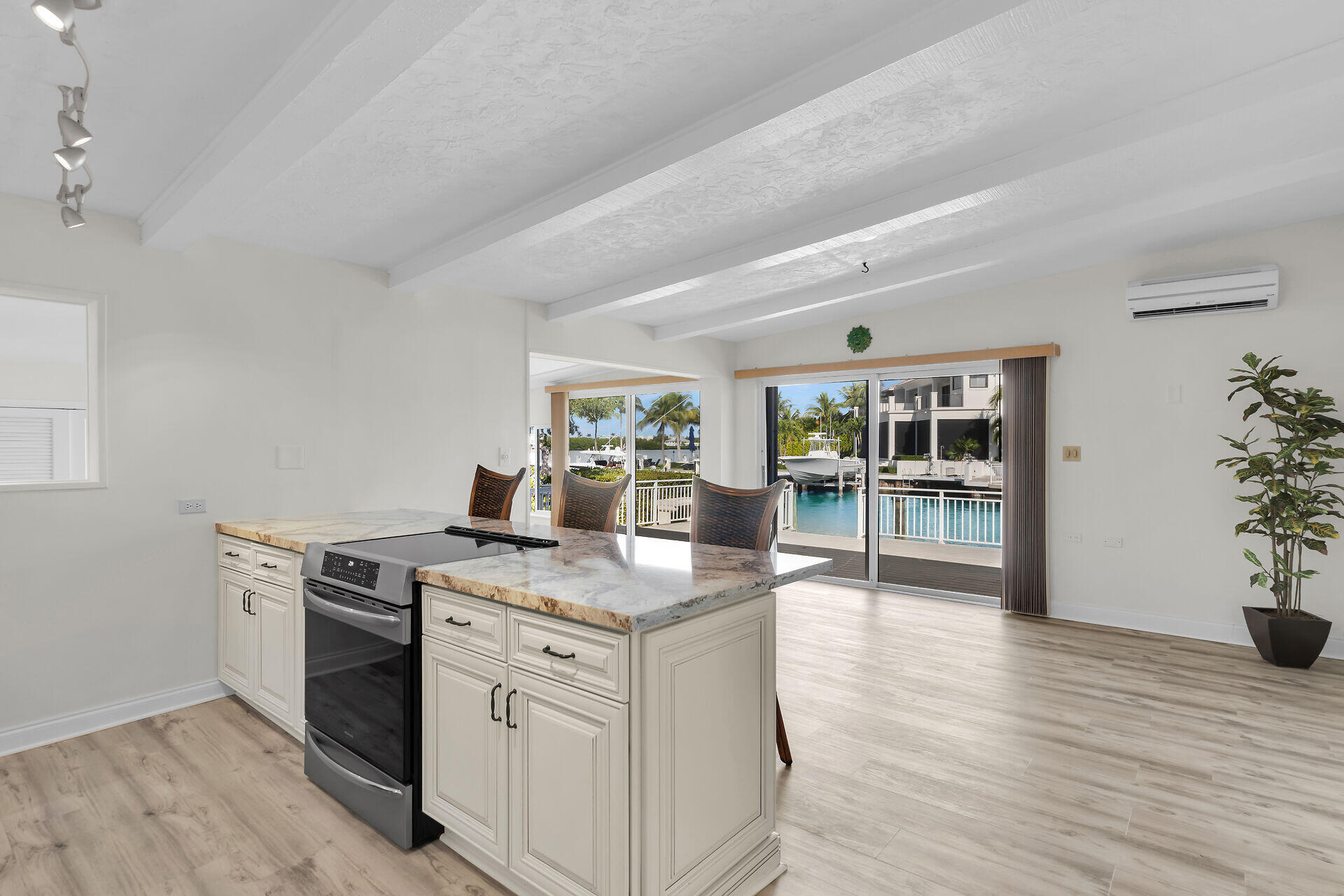 750 9th Street Key Colony Beach, FL 33051 - Photo 13 of 30 a kitchen with sink and cabinets