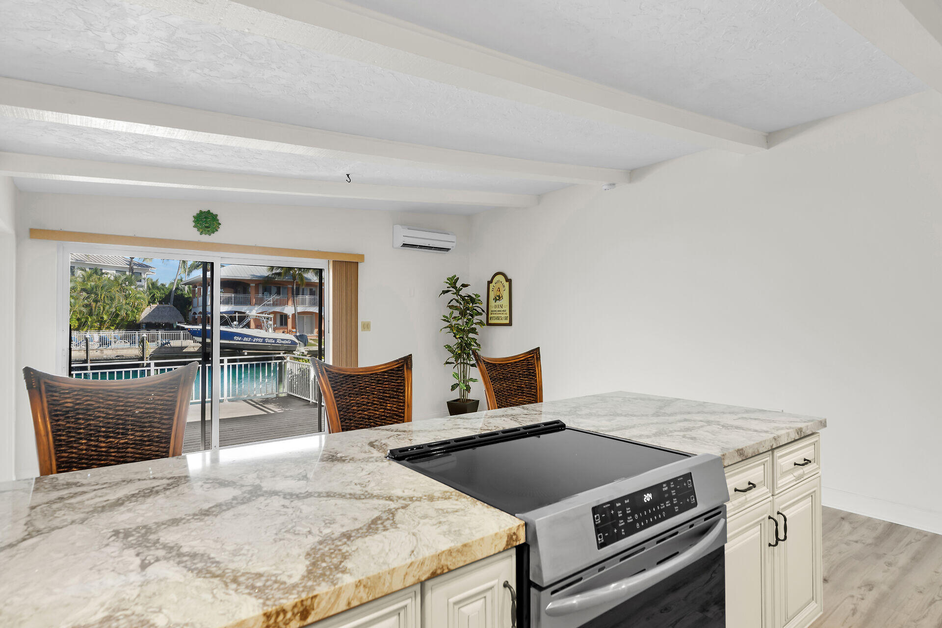 750 9th Street Key Colony Beach, FL 33051 - Photo 15 of 30 a kitchen with a stove and a refrigerator