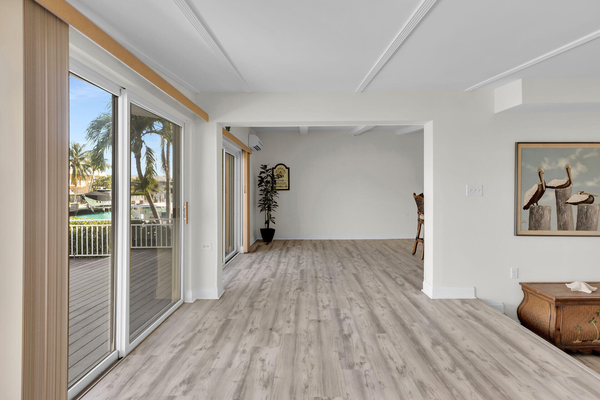 750 9th Street Key Colony Beach, FL 33051 - Photo 17 of 30 a view of empty room with wooden floor and fan