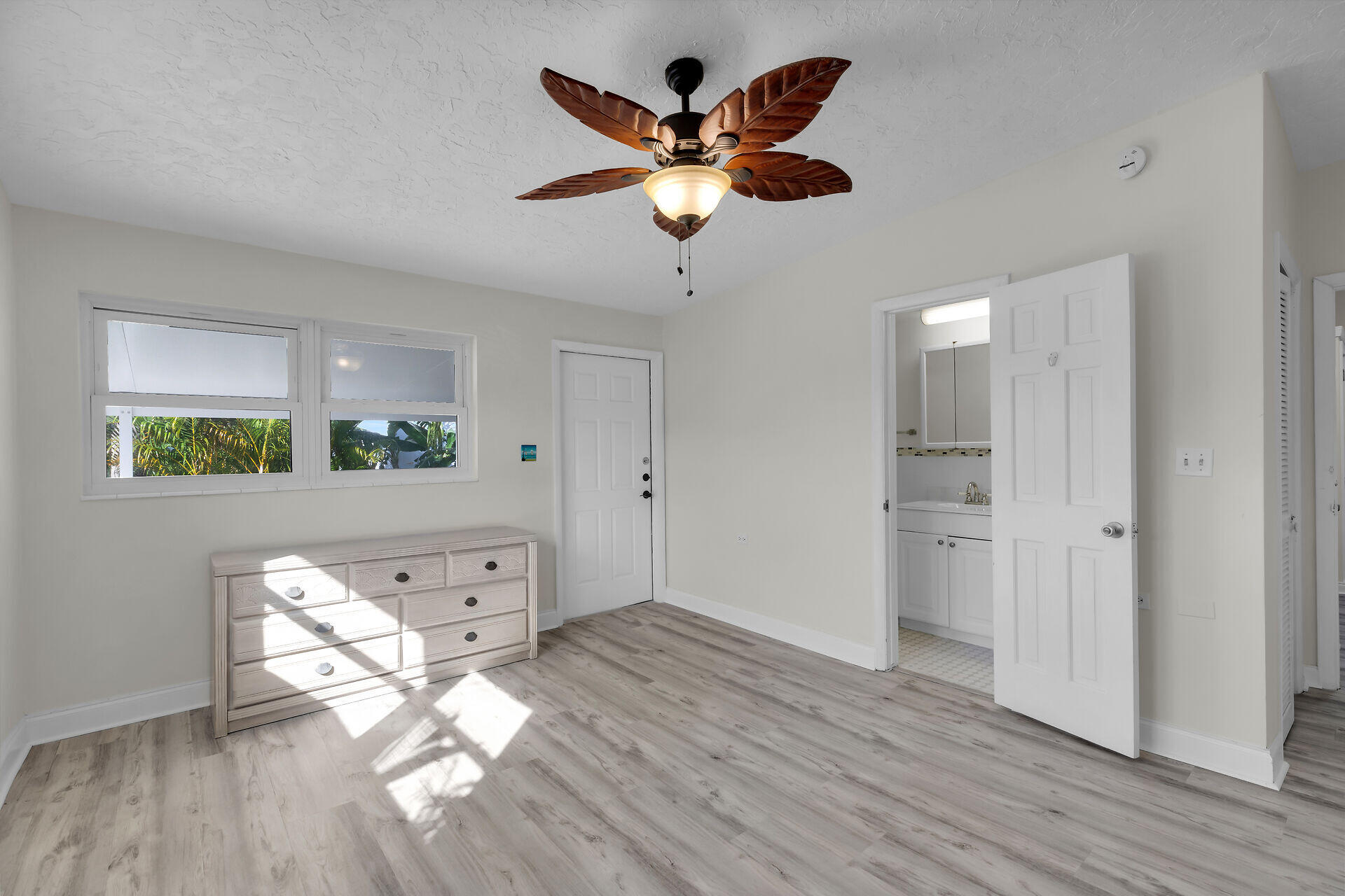 750 9th Street Key Colony Beach, FL 33051 - Photo 21 of 30 a view of an empty room and wooden floor