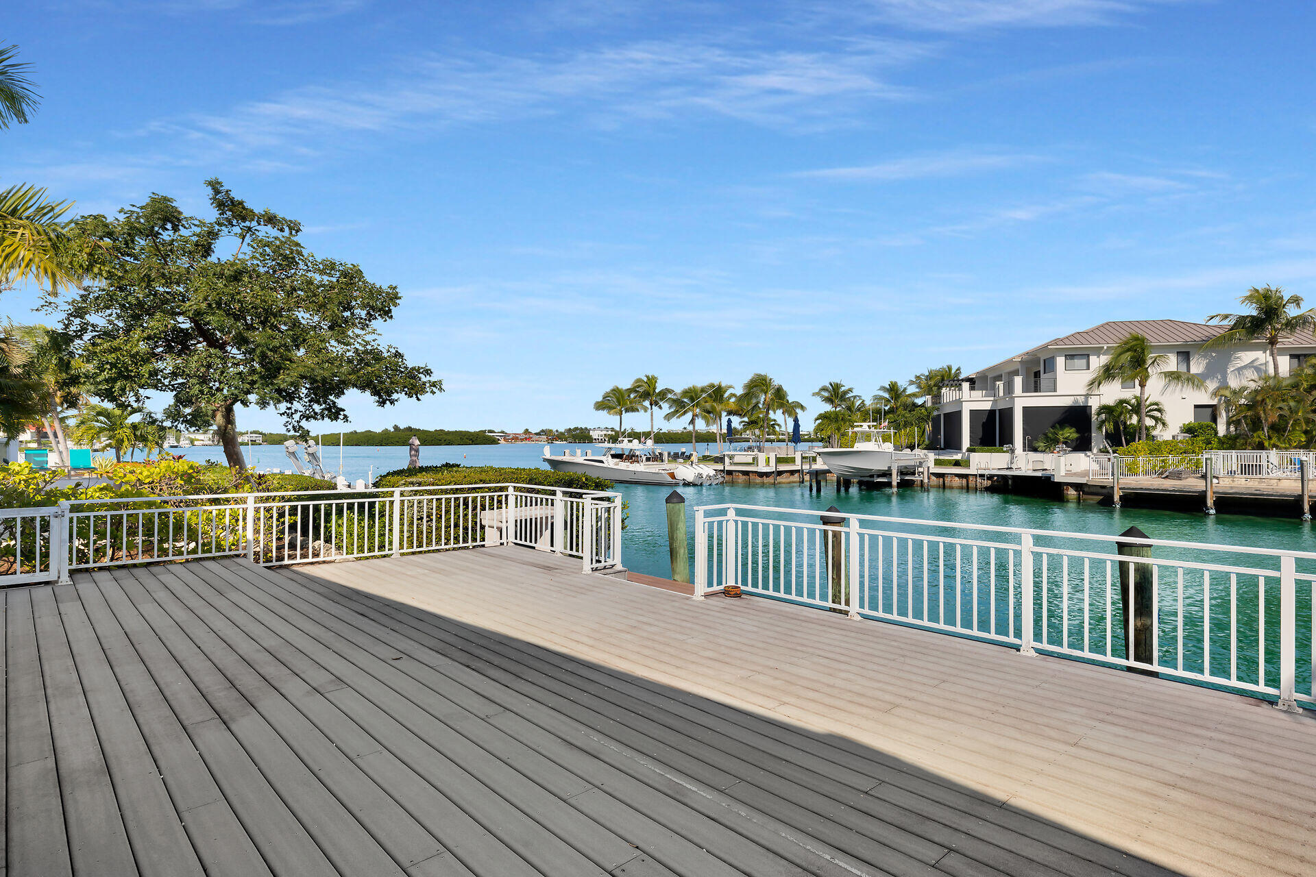 750 9th Street Key Colony Beach, FL 33051 - Photo 6 of 30 a view of a lake with boats and trees in the background
