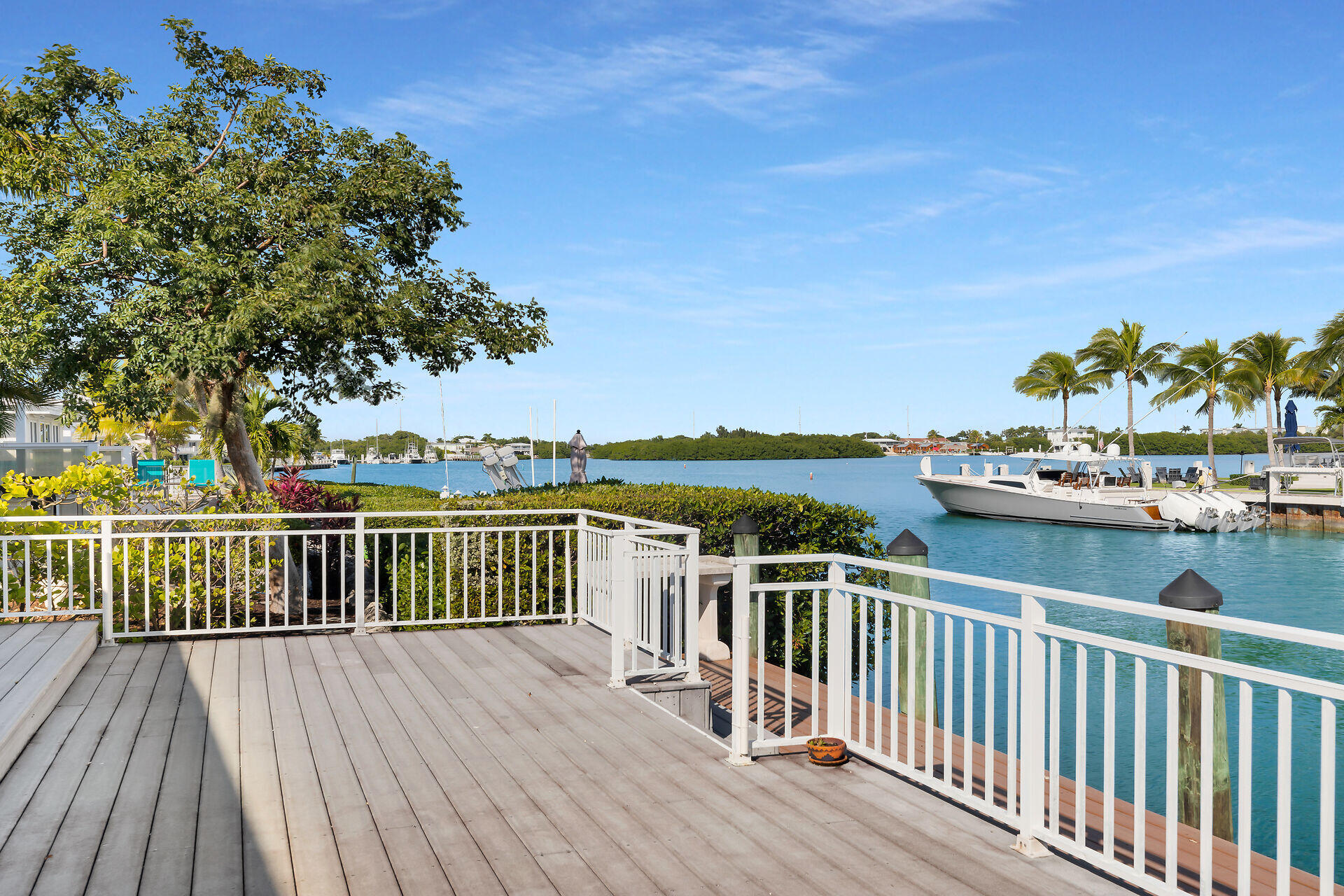 750 9th Street Key Colony Beach, FL 33051 - Photo 7 of 30 a view of a balcony with wooden floor and fence