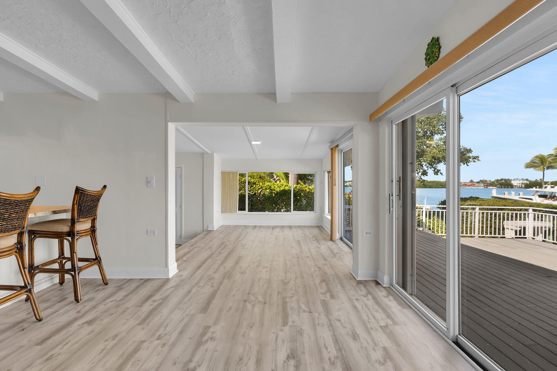 750 9th Street Key Colony Beach, FL 33051 - Photo 10 of 30 a view of a hallway with wooden floor and furniture