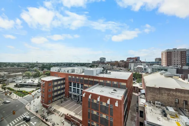 a view of parking area with parked cars