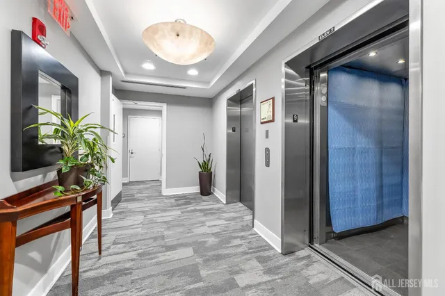 a view of an entryway with wooden floor