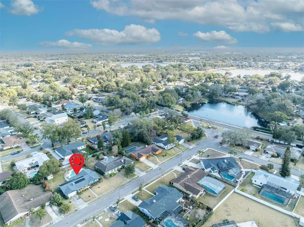 an aerial view of residential houses with outdoor space