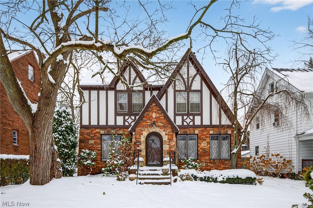 3498 Bainbridge Road Cleveland Heights, OH 44118 - Photo 1 of 50 Tudor-style house with brick siding and stucco siding
