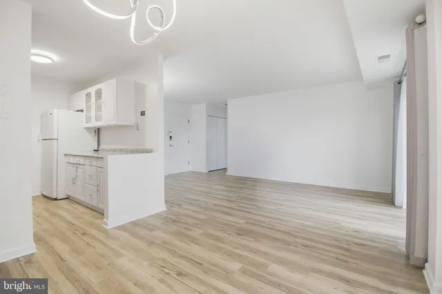 a view of kitchen with wooden floor
