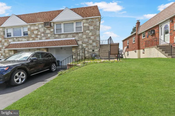 a car parked in front of a house