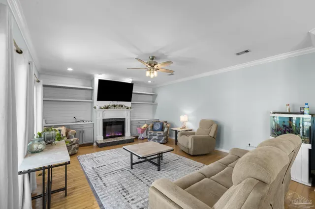 a living room with furniture fireplace and a flat screen tv