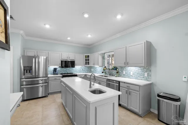a kitchen with sink and cabinets