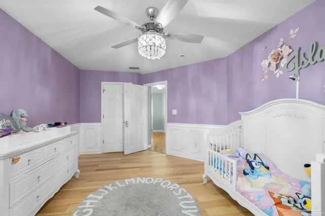 a bathroom with a bathtub a window and a shower