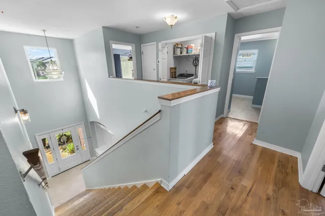 a en suite bathroom with a sink double vanity granite and a mirror