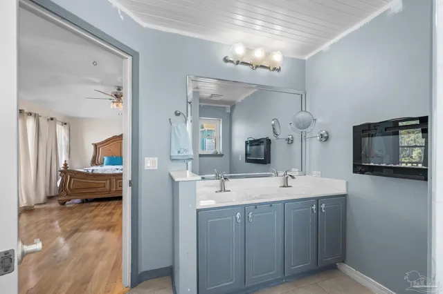 a bathroom with a bathtub and a window