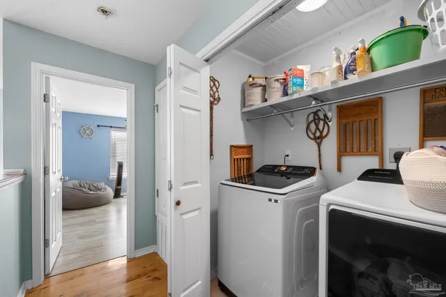 a bedroom with furniture and a chandelier
