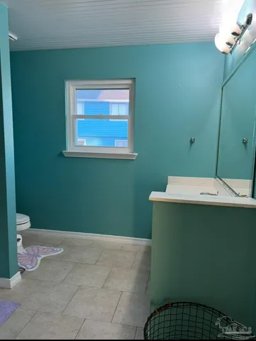 a view of balcony with wooden floor and outdoor seating