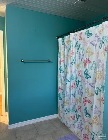 a view of a balcony with wooden floor