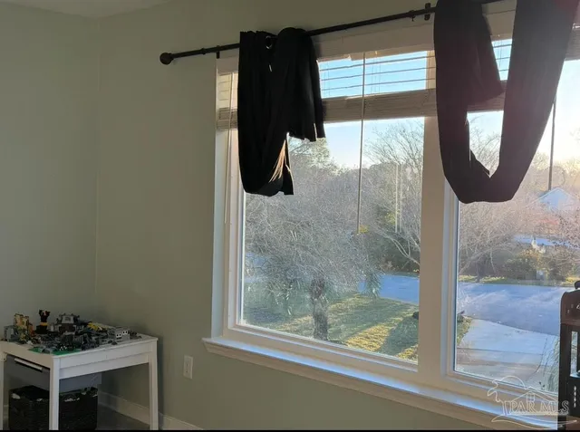 a living room with furniture fireplace and wooden floor