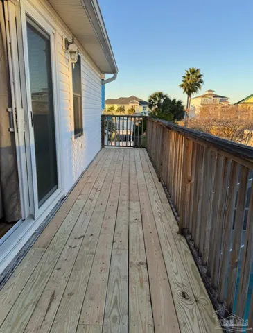 a view of a balcony with two chairs