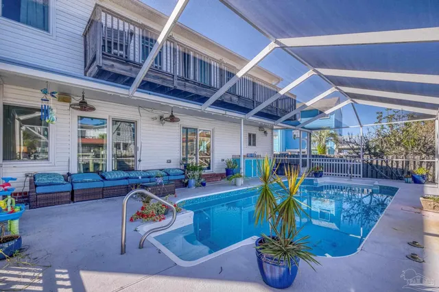 a front view of a house with a yard and tree